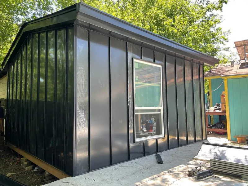 Black standing seam metal wall panels for Roof Inspection in Ipswich